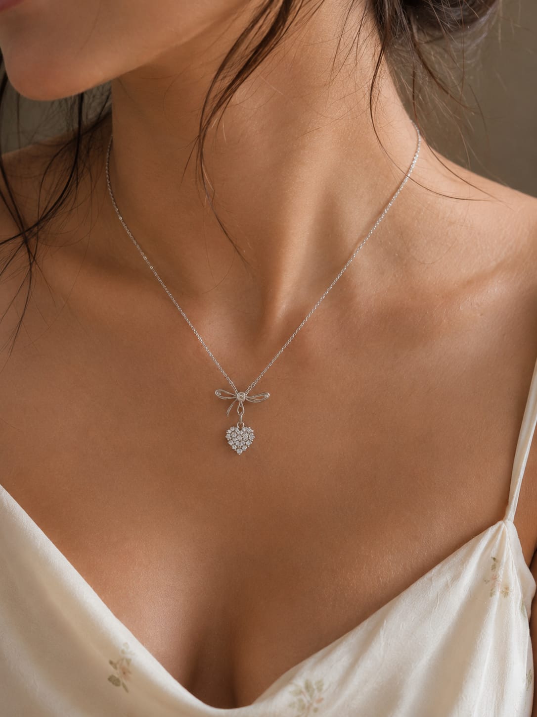 Silver heart bow pendant necklace