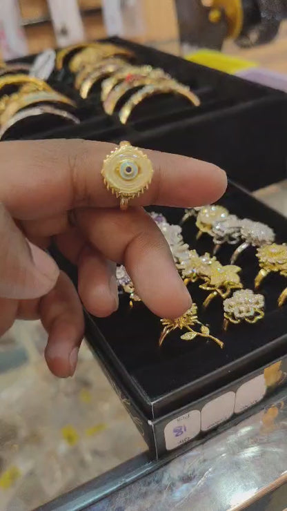 Evil eye revolving ring